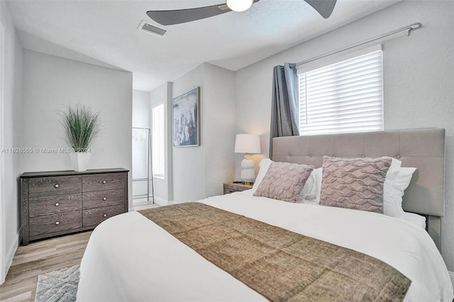 bedroom featuring light wood-type flooring and ceiling fan