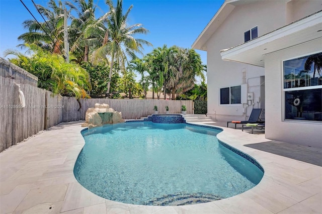 view of swimming pool with a patio