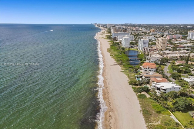 bird's eye view with a beach view and a water view