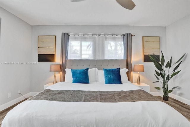 bedroom featuring ceiling fan and hardwood / wood-style floors