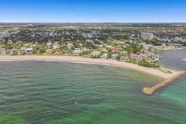 drone / aerial view with a water view and a view of the beach