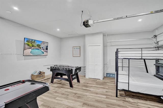 recreation room featuring light hardwood / wood-style floors