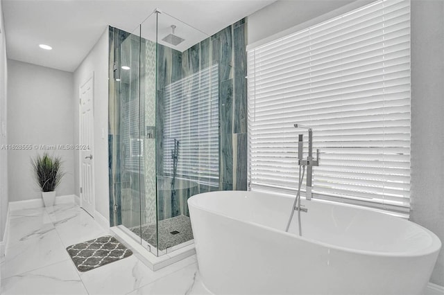 bathroom with shower with separate bathtub