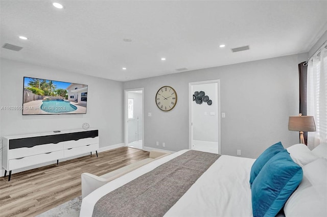 bedroom with light hardwood / wood-style floors