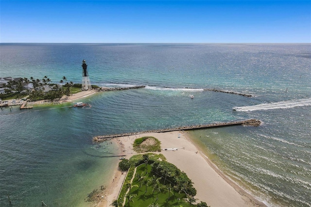 birds eye view of property with a water view and a view of the beach