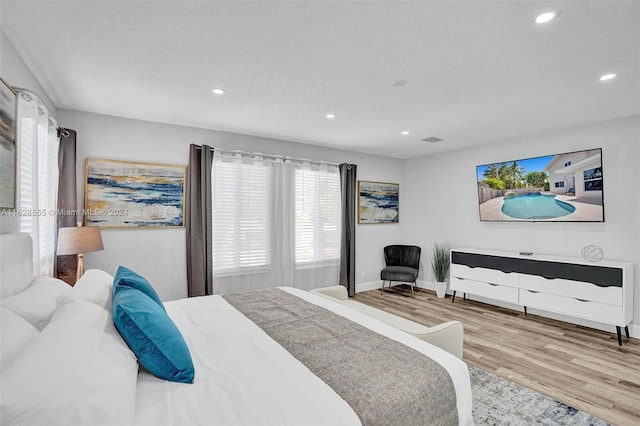 bedroom with light hardwood / wood-style flooring