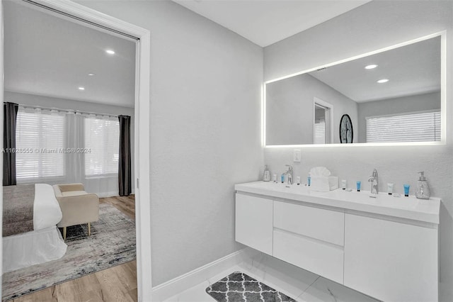 bathroom with hardwood / wood-style flooring and vanity