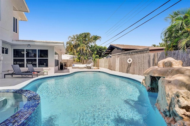 view of swimming pool featuring a patio