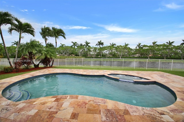 view of pool with an in ground hot tub