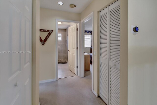 hallway with light tile patterned flooring