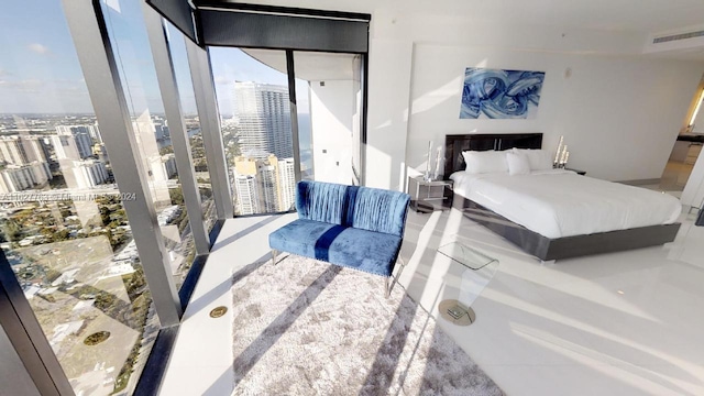 bedroom featuring floor to ceiling windows