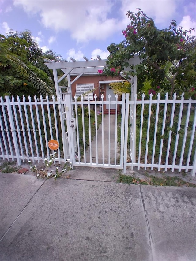 view of gate featuring fence