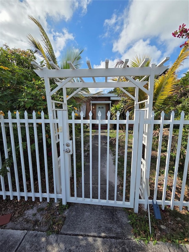 view of gate featuring fence
