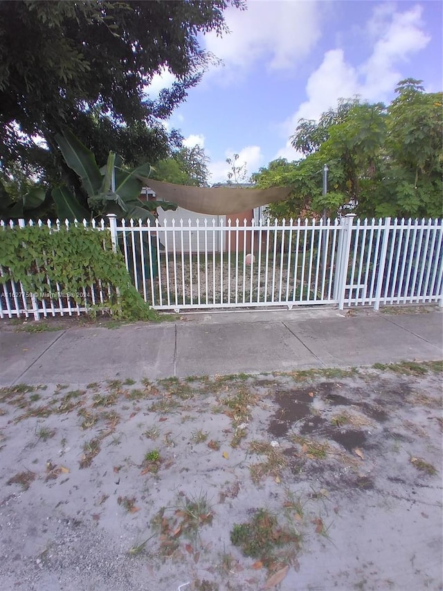 view of gate with fence