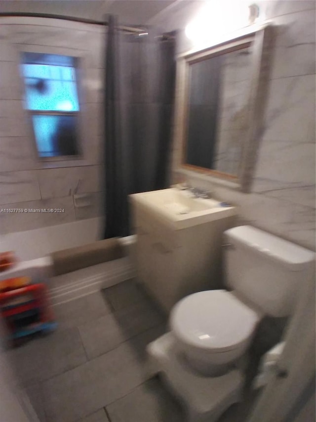 full bathroom with shower / bath combination with curtain, tile patterned flooring, tile walls, and toilet