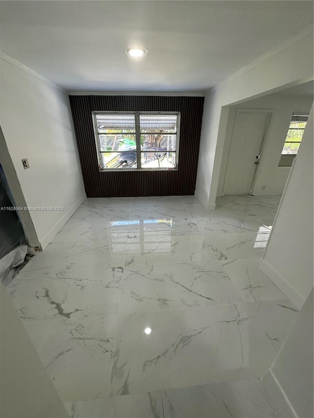 unfurnished room featuring ornamental molding