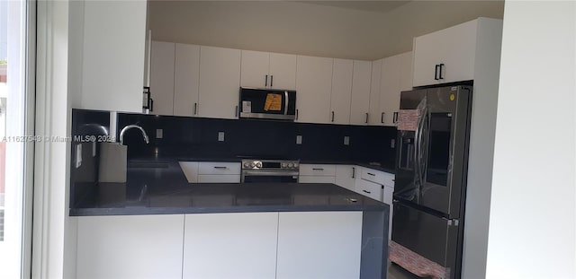 kitchen featuring backsplash, white cabinetry, sink, and stainless steel appliances