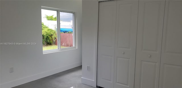 unfurnished bedroom with a closet