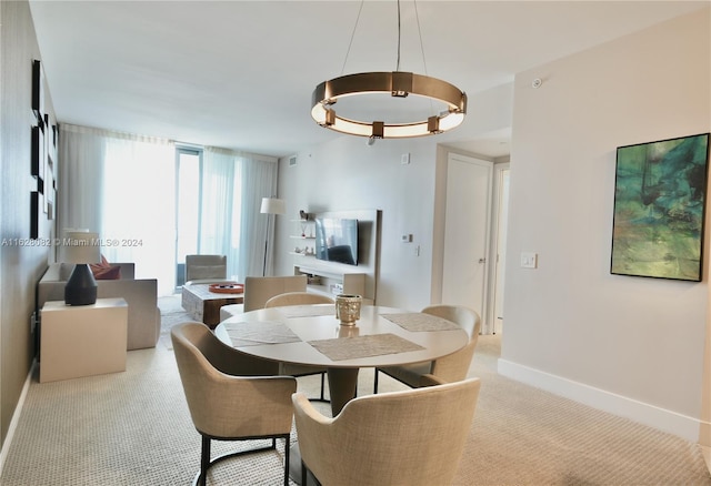 dining area with light colored carpet