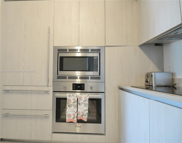 kitchen with appliances with stainless steel finishes and light brown cabinets