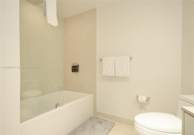 full bathroom with tiled shower / bath combo, vanity, tile patterned floors, and toilet