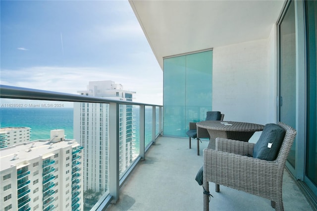 balcony featuring a water view