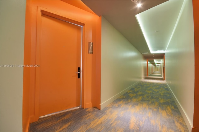 hallway with dark wood-type flooring