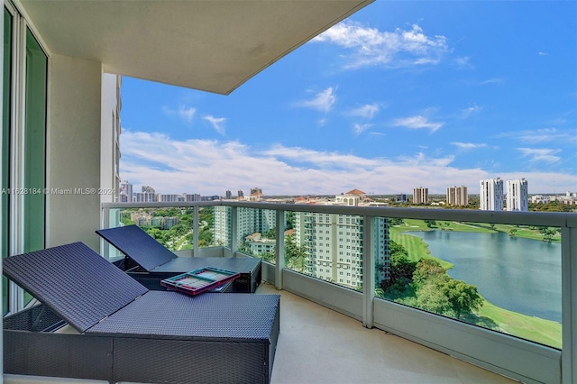 balcony featuring a water view