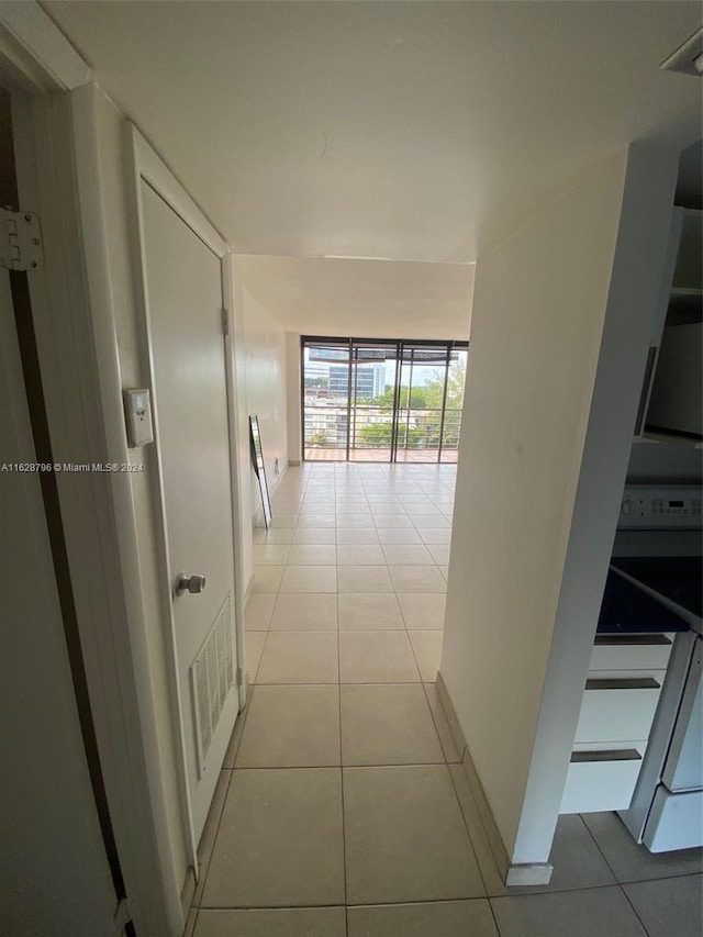 hallway with light tile patterned flooring