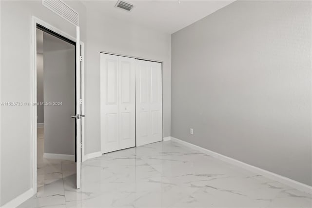 unfurnished bedroom featuring a closet