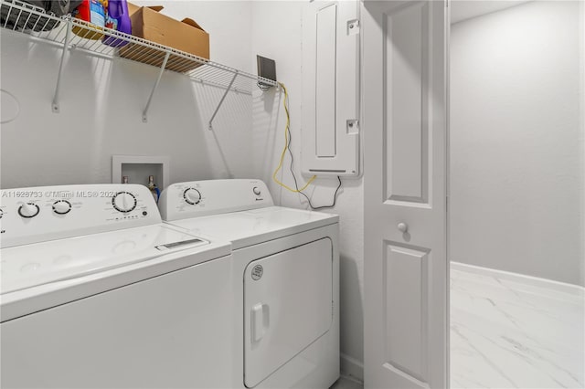 washroom with electric panel and washer and dryer