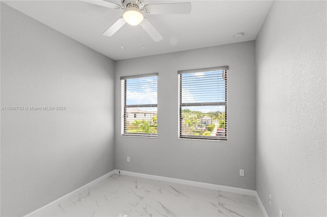 unfurnished room with ceiling fan