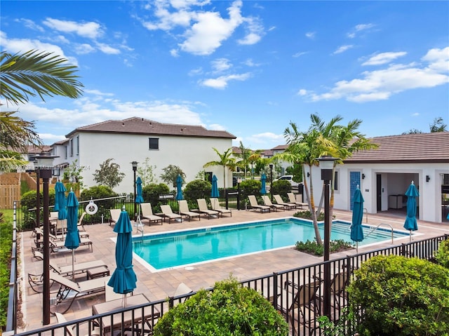 view of swimming pool with a patio