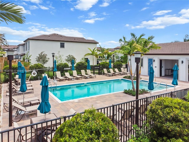 view of swimming pool featuring a patio area