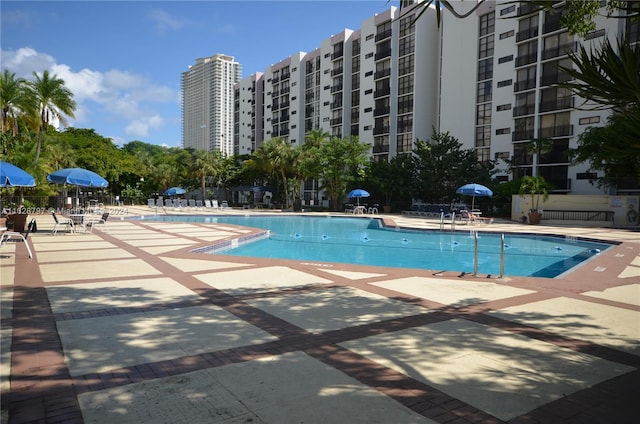 view of swimming pool with a patio