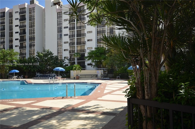 view of swimming pool featuring a patio