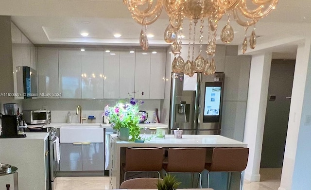 kitchen featuring white cabinetry, sink, and stainless steel appliances