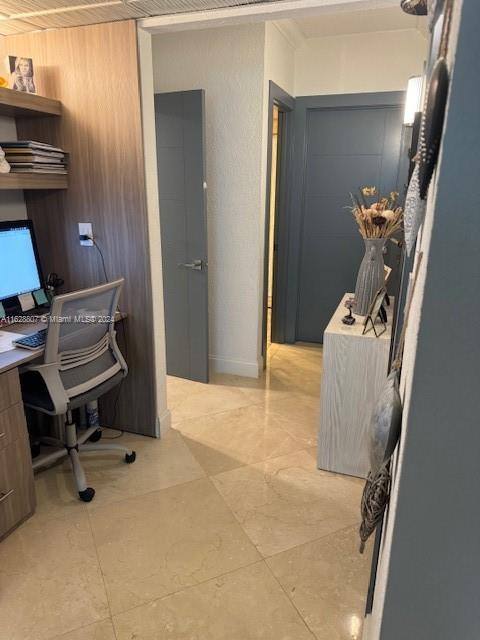 office area featuring wood walls