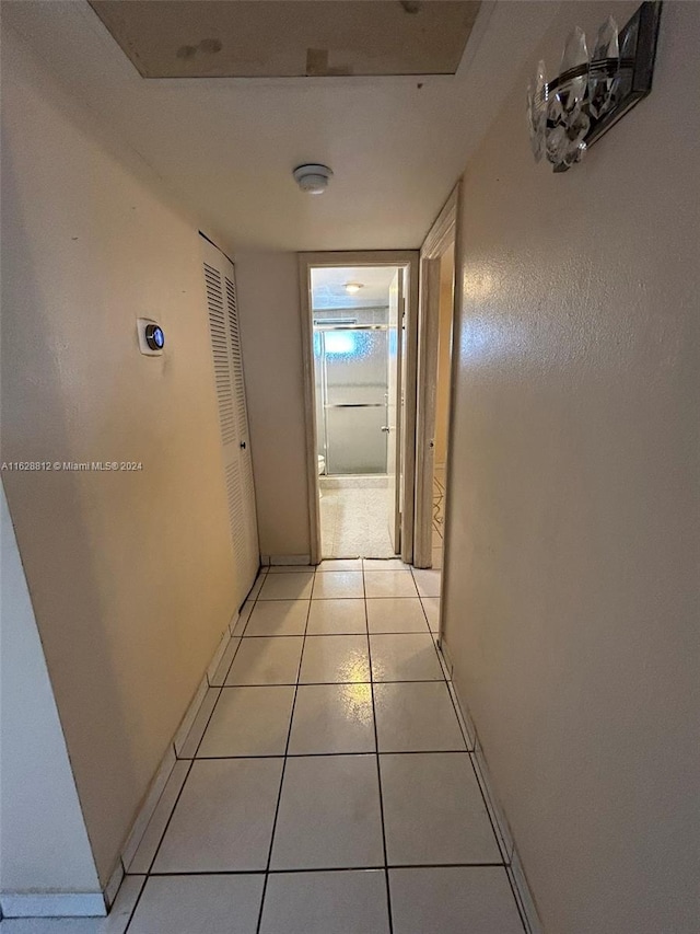 hallway with light tile patterned floors