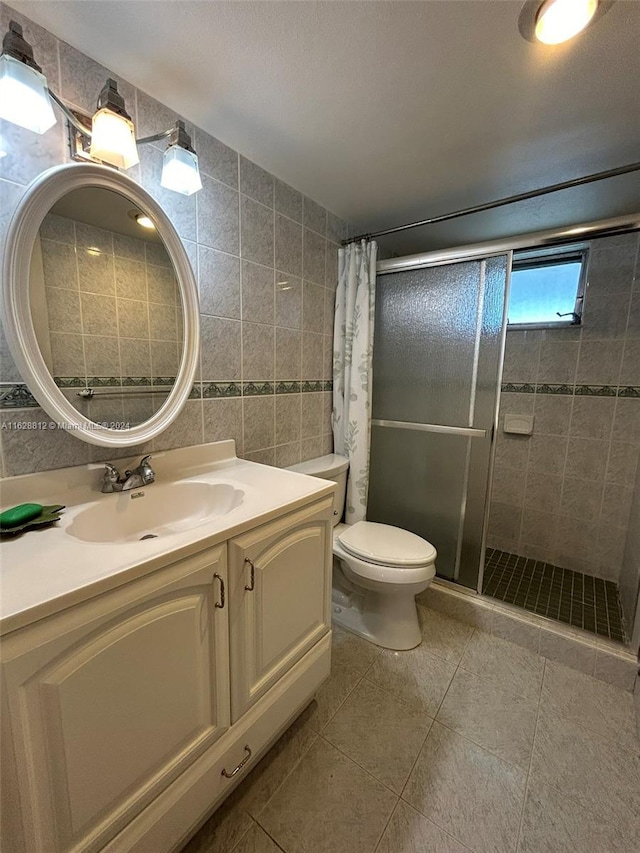 3600 NE 170th St Unit 411, North Miami Beach, FL 33160 - full bath with a stall shower, toilet, tile patterned floors, vanity, and tile walls