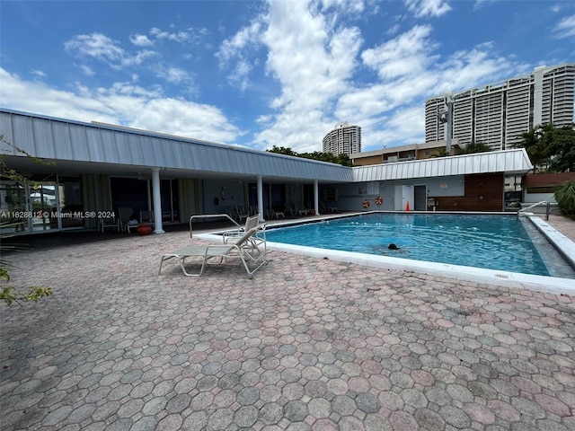 view of swimming pool featuring a patio area