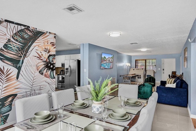 208 SW 2nd Ave, Hallandale Beach, FL 33009 - dining room with baseboards and light tile patterned floors