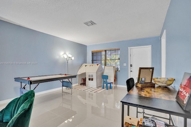 208 SW 2nd Ave, Hallandale Beach, FL 33009 - game room with a textured ceiling and tile patterned floors