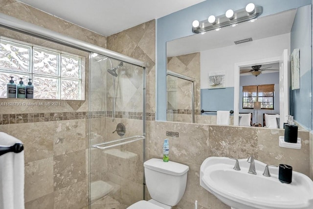 208 SW 2nd Ave, Hallandale Beach, FL 33009 - bathroom featuring a ceiling fan, a shower stall, and tile walls