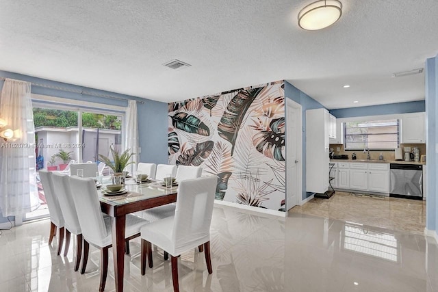 208 SW 2nd Ave, Hallandale Beach, FL 33009 - dining room with a textured ceiling