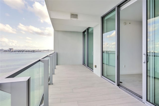 balcony featuring a water view