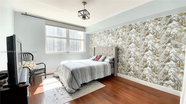 31 SE 5th St Unit 3008, Miami, FL 33131 - bedroom with wallpapered walls, wood finished floors, and an accent wall