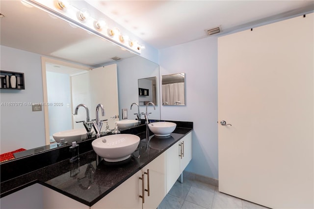 bathroom featuring vanity and tile patterned floors