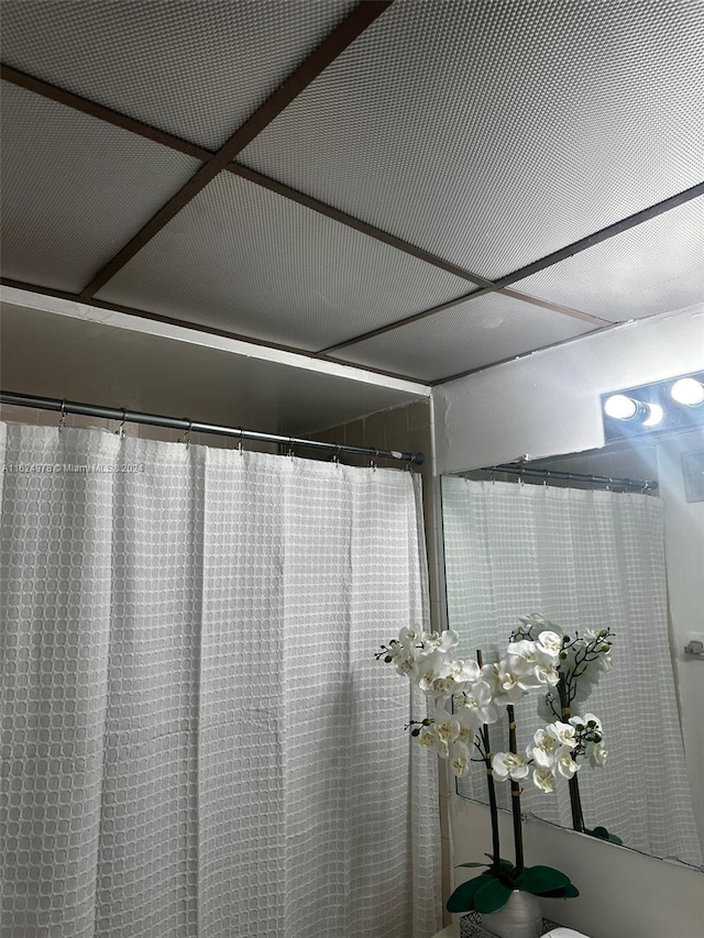 interior details featuring a shower with curtain