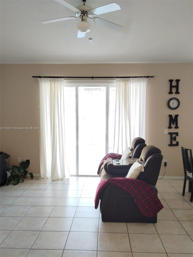 tiled living room featuring ceiling fan